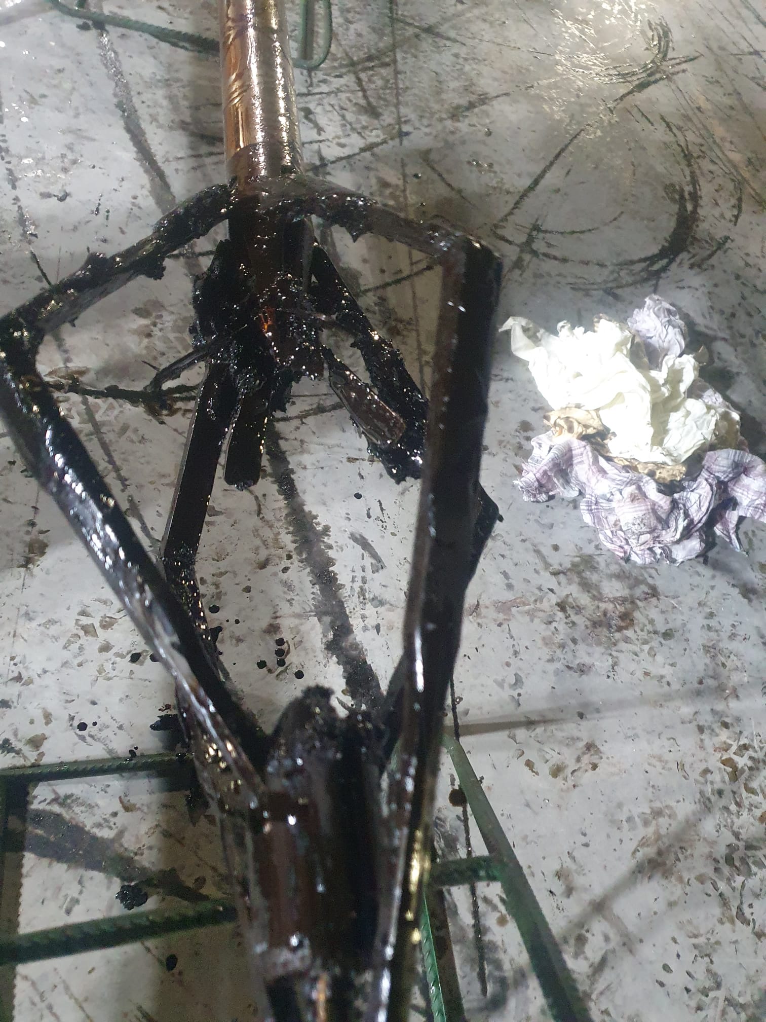 PLT tool string after production logging operation showing sensors and gauges used in well diagnostics